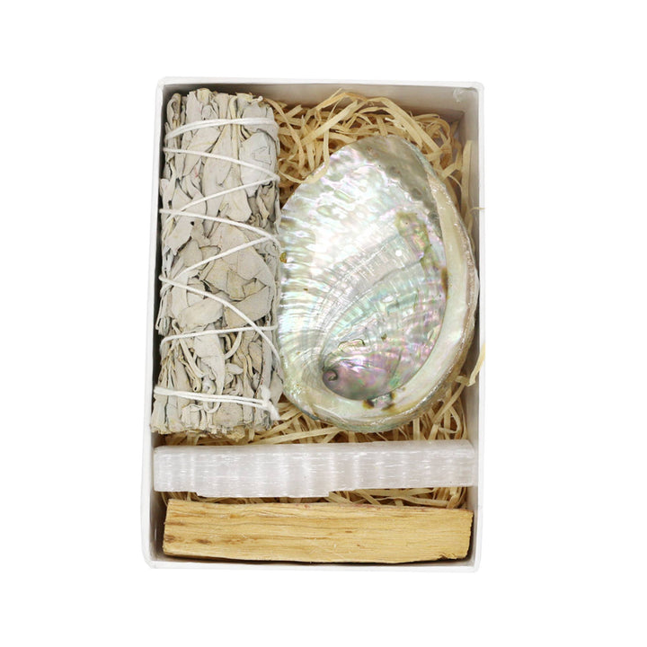 Cleanse and center with our mini smudge kit—white sage, selenite, palo santo, and abalone shell for rituals, and clearing.