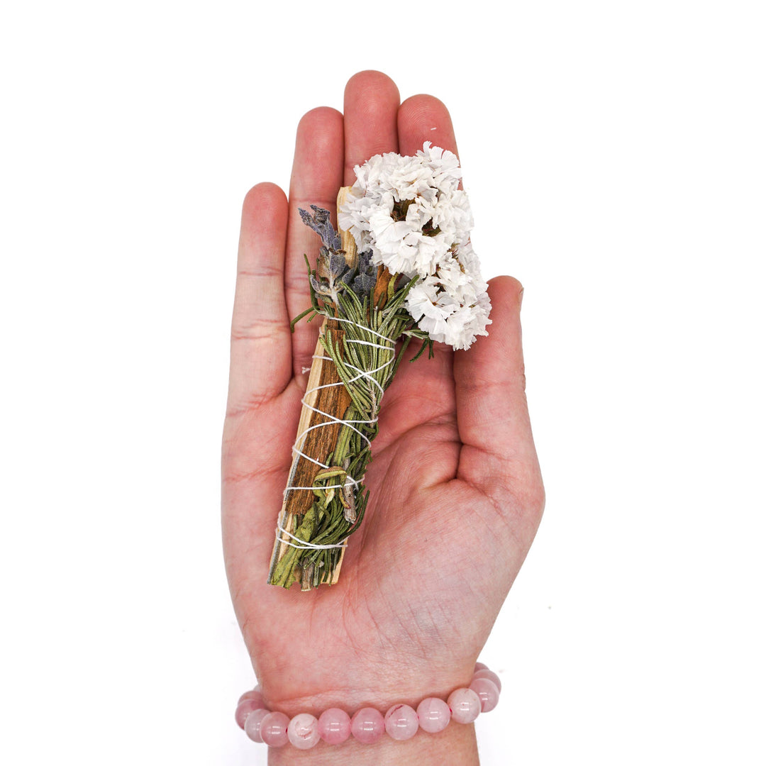 Cleanse and uplift with floral Palo Santo smudge sticks—lavender, rosemary, cinnamon, and sinuata for sacred energy clearing.