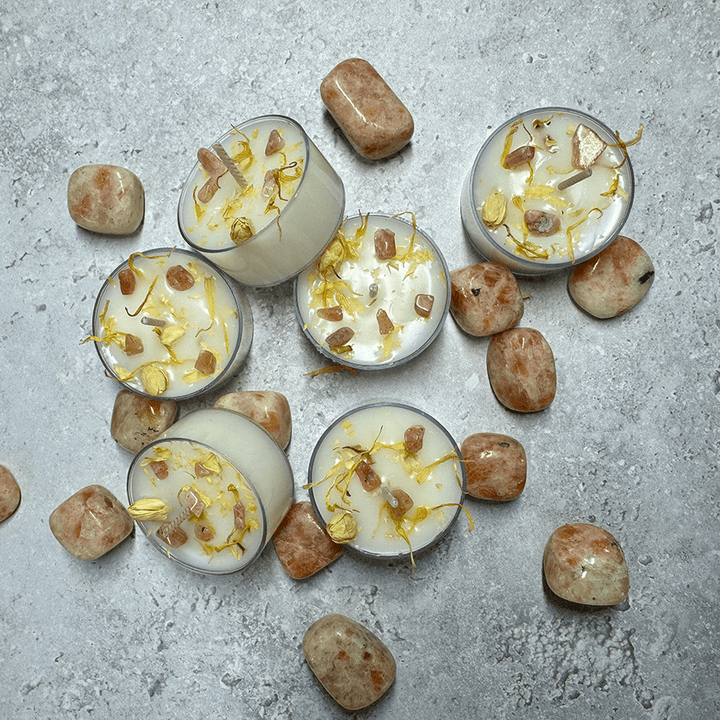 Celebrate midsummer with spell candles infused with honeysuckle, basil, and sunstone—ideal for rituals.
